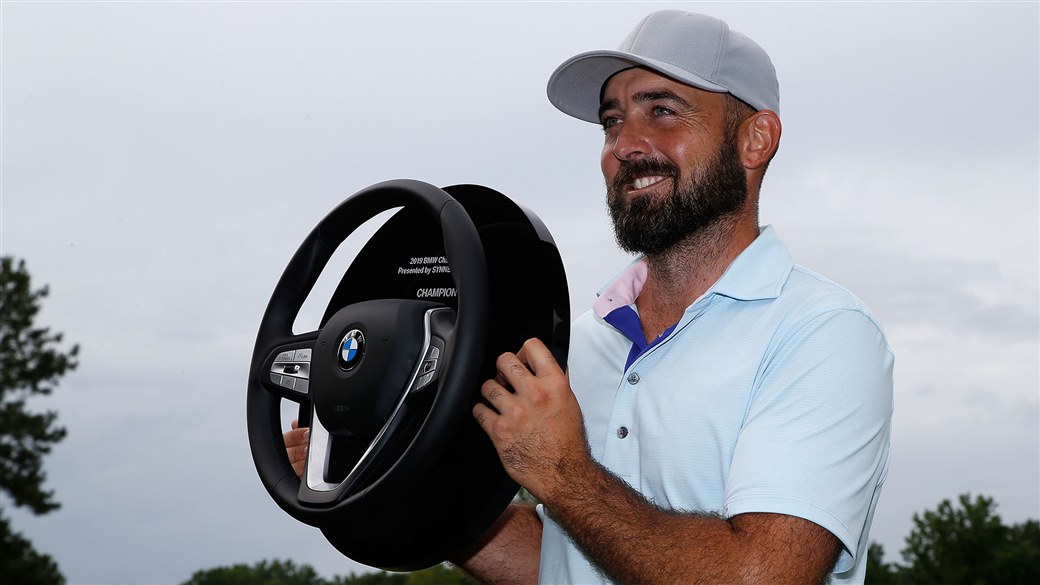 Rhein Gibson raises the winner's trophy at the Web.com TOur's BMW Charity Pro-Am